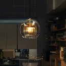 Glass globe pendant light over the island pendant lights