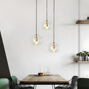 Glass globe pendant light over the island pendant lights