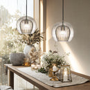 Glass globe pendant light over the island pendant lights