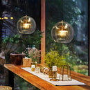 Glass globe pendant light over the island pendant lights